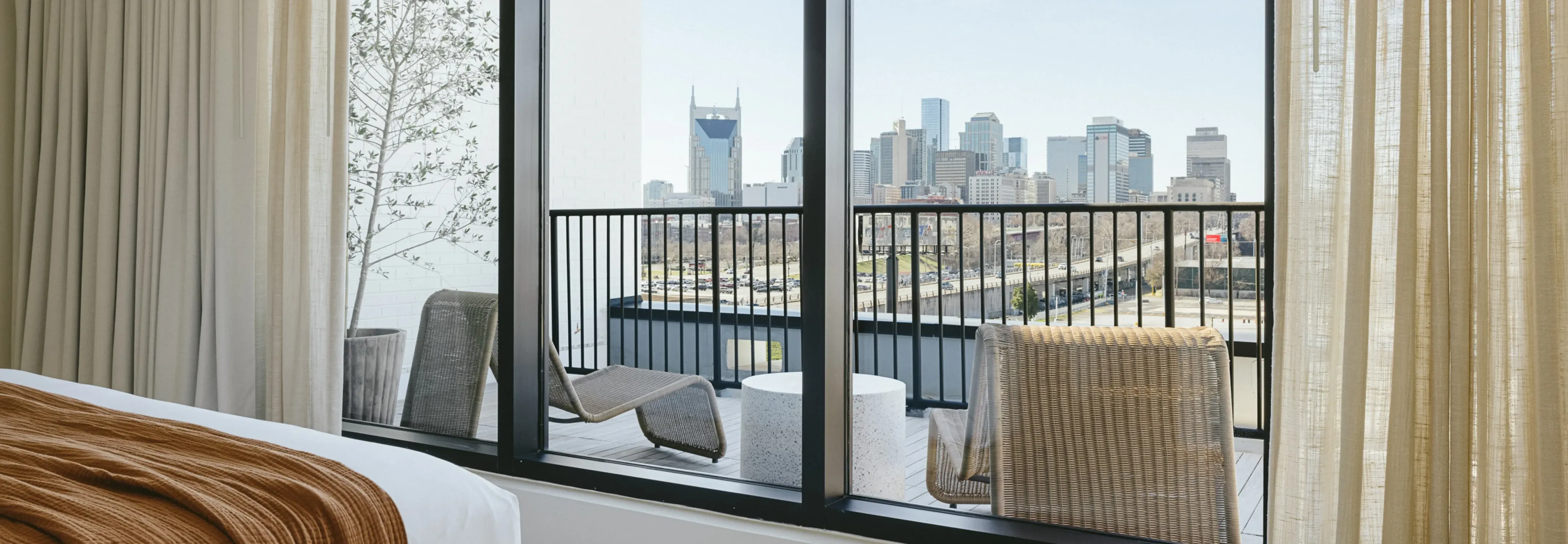 A guest room balcony overlooking the Nashville skyline